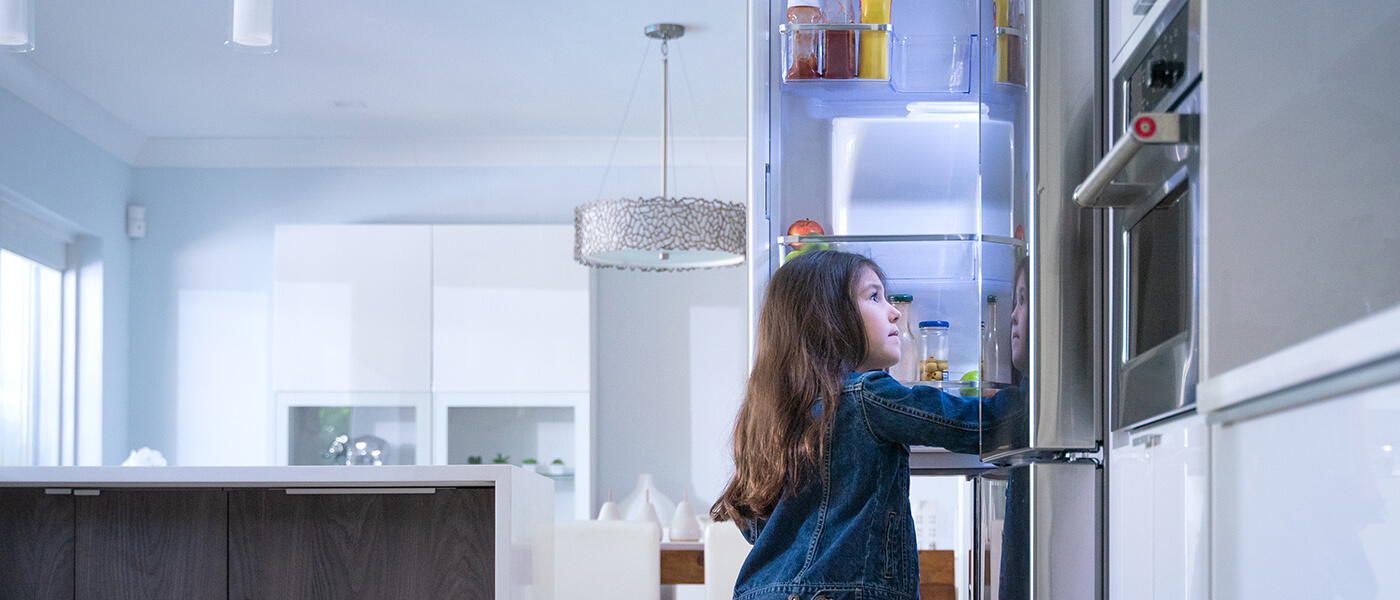 home appliance with little girl